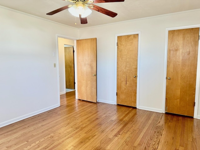 unfurnished bedroom featuring ceiling fan, ornamental molding, and light hardwood / wood-style floors