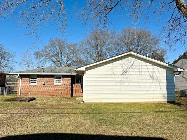 view of side of property with a yard