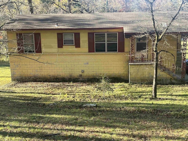 view of property exterior with a lawn