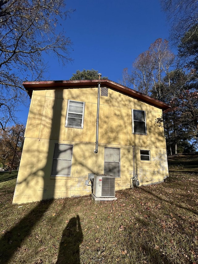 view of property exterior with central AC unit