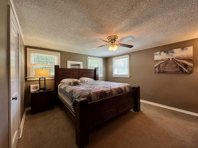  - carpeted bedroom with baseboards, a ceiling fan, and a textured ceiling