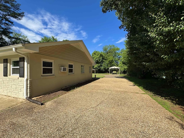 - view of home's exterior with concrete driveway