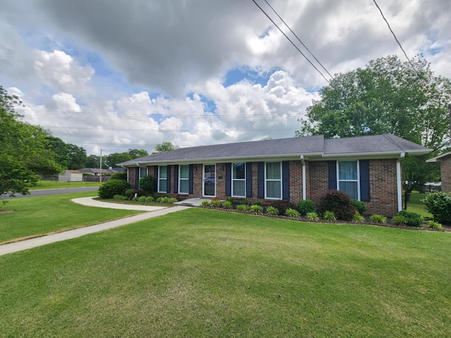 single story home with brick siding and a front yard