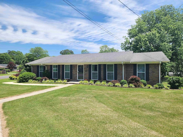  - ranch-style house with brick siding and a front yard