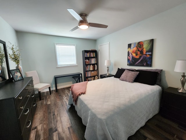bedroom featuring dark wood-type flooring, ceiling fan, and baseboards