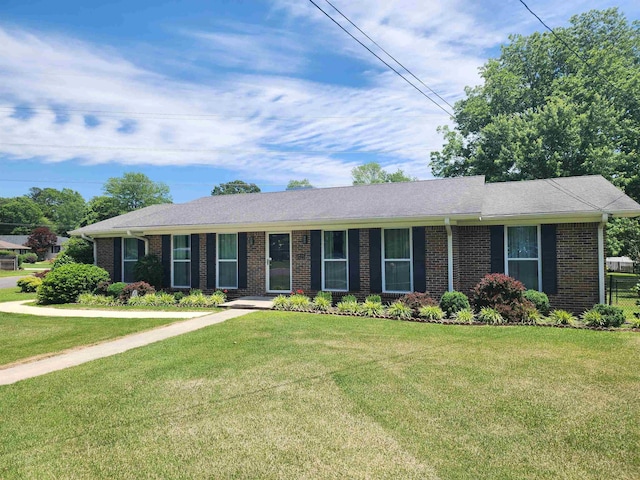  - ranch-style house with brick siding and a front yard