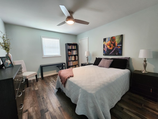 bedroom featuring dark wood-style floors, baseboards, and ceiling fan