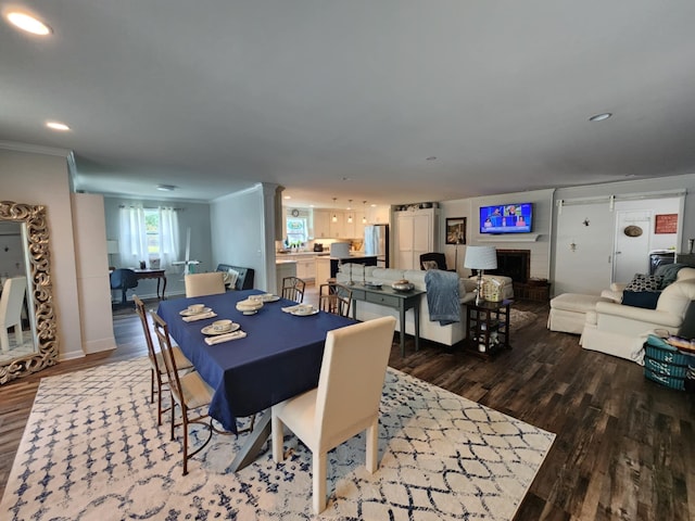 dining room featuring ornamental molding, dark wood-style flooring, recessed lighting, and baseboards