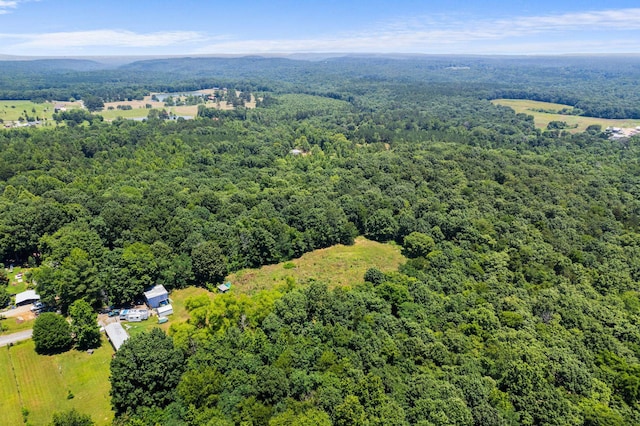 drone / aerial view featuring a view of trees