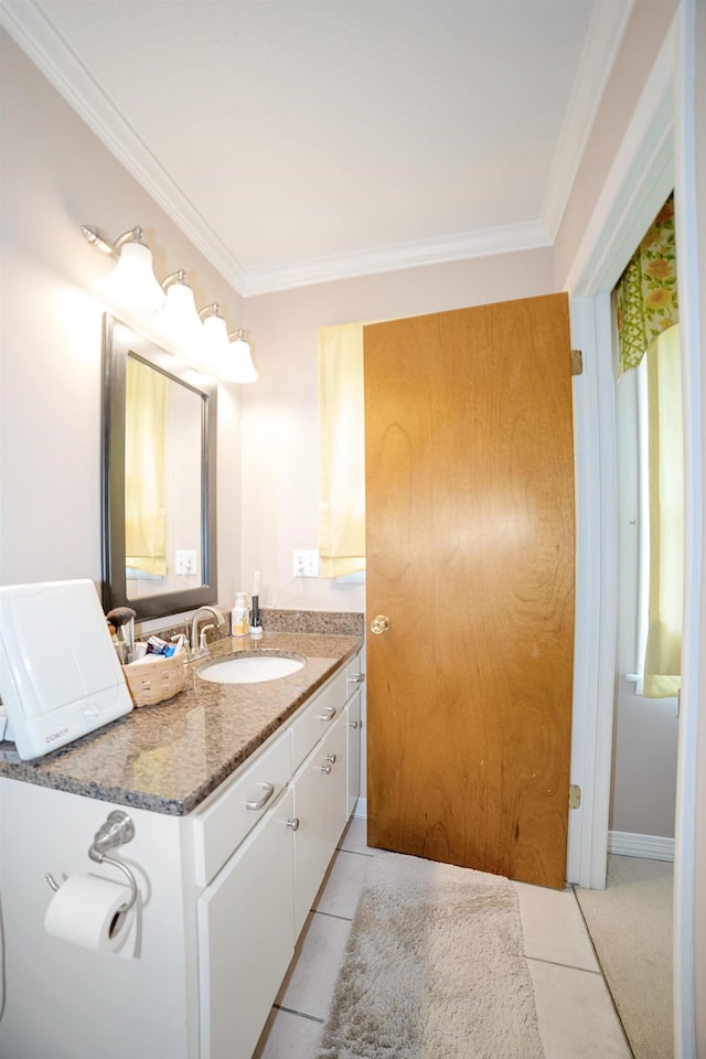 bathroom with tile patterned floors, vanity, and ornamental molding