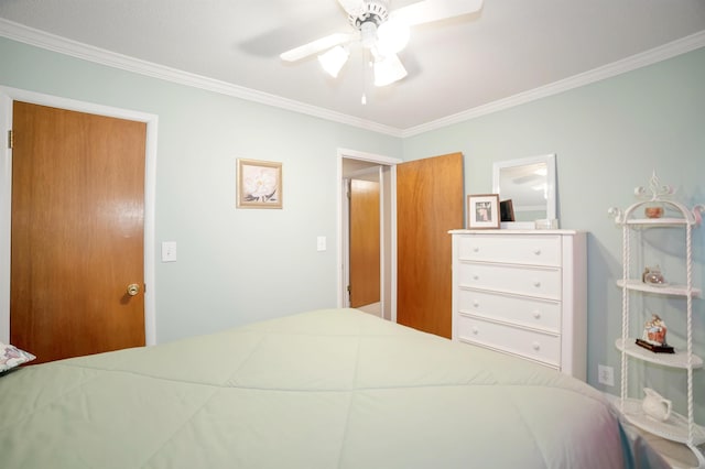 bedroom featuring ornamental molding and ceiling fan