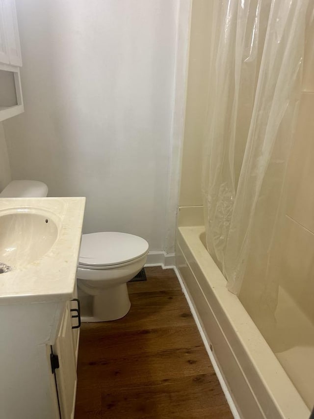  - full bathroom featuring vanity, wood finished floors, and shower / bath combination with curtain