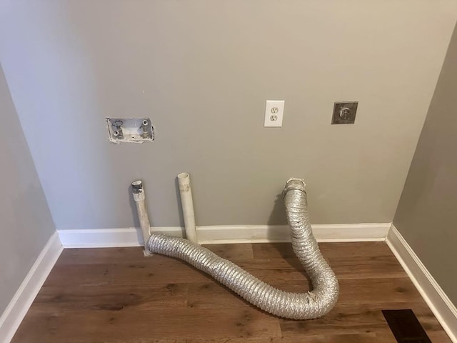  - washroom featuring hookup for an electric dryer and wood finished floors
