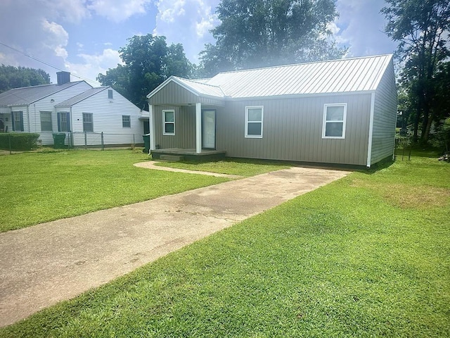  - view of front of property with concrete driveway and a metal roof