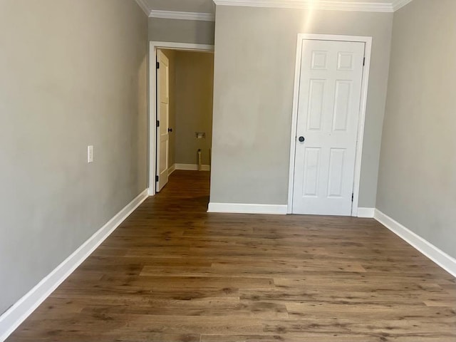  - unfurnished bedroom with ornamental molding and wood finished floors