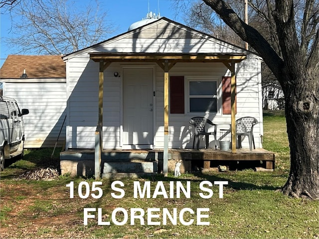 view of front of property with covered porch and roof with shingles