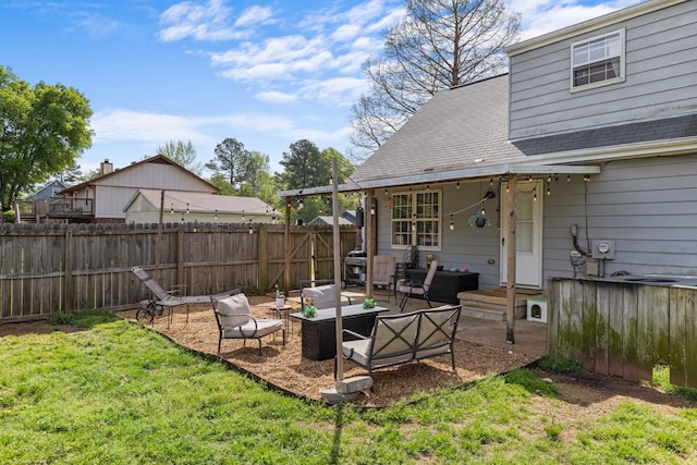 view of yard featuring an outdoor living space, a patio, and fence