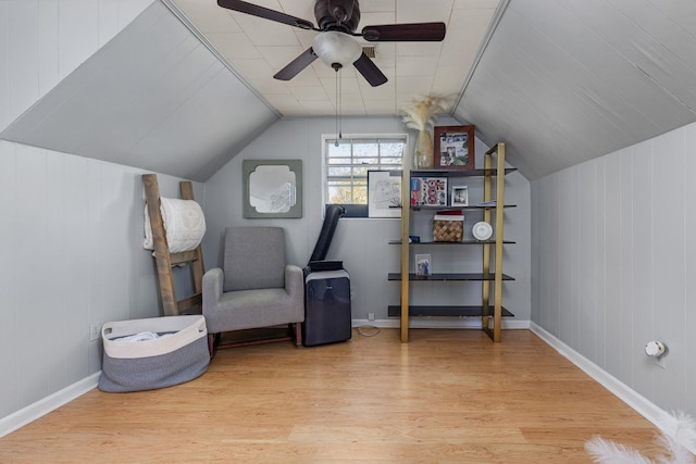 sitting room with light wood finished floors, ceiling fan, and lofted ceiling