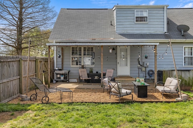 back of house featuring a patio, a fenced backyard, and a yard