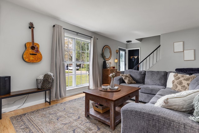 living room featuring stairway and wood finished floors