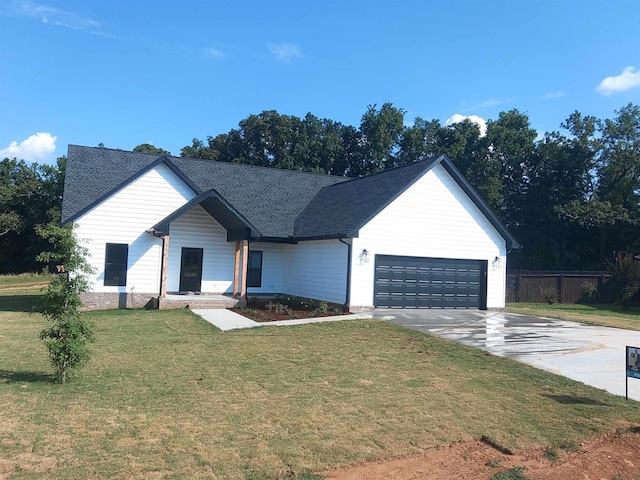 modern inspired farmhouse featuring a front lawn and a garage