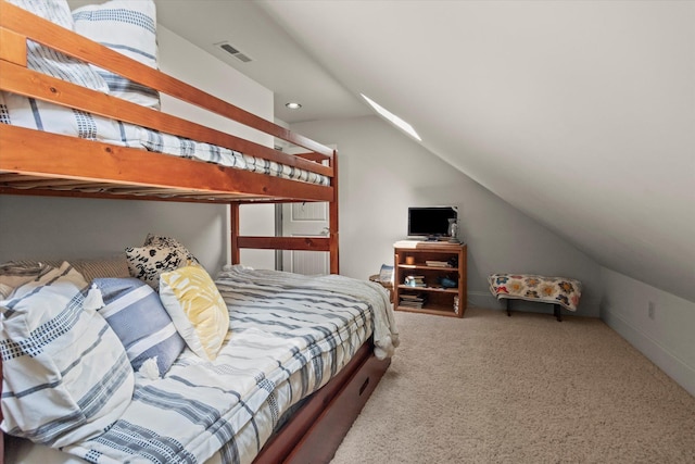  - carpeted bedroom with lofted ceiling and recessed lighting