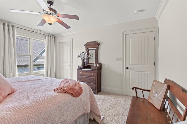  - bedroom with wood finished floors, crown molding, a ceiling fan, and baseboards