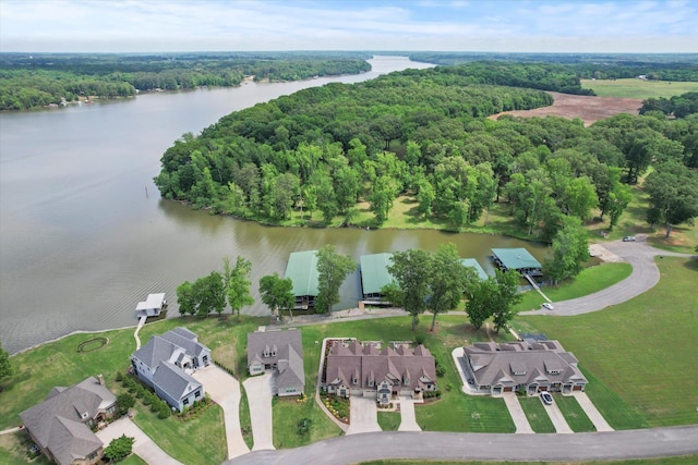  - aerial view of property's location with a nearby body of water and a heavily wooded area