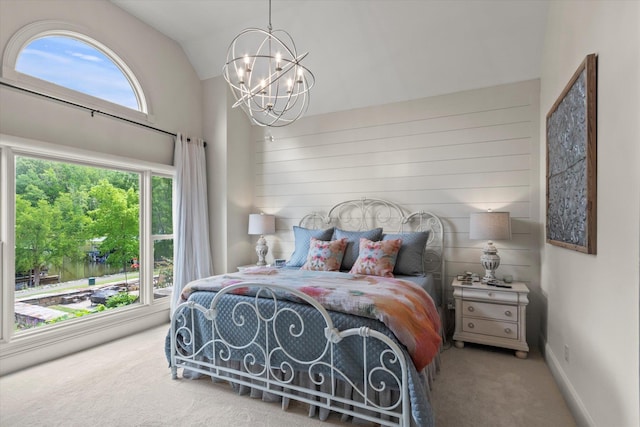  - carpeted bedroom featuring a chandelier and lofted ceiling