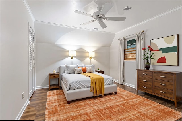  - bedroom with wood finished floors, ornamental molding, baseboards, ceiling fan, and a closet