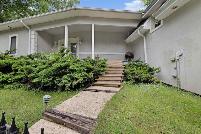  - view of exterior entry with stucco siding