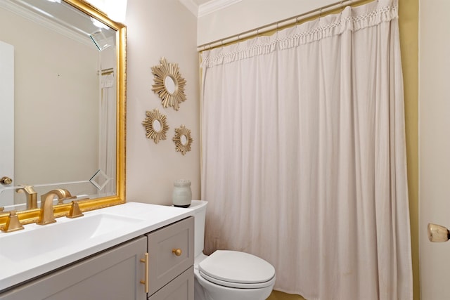 - bathroom featuring crown molding, toilet, and vanity