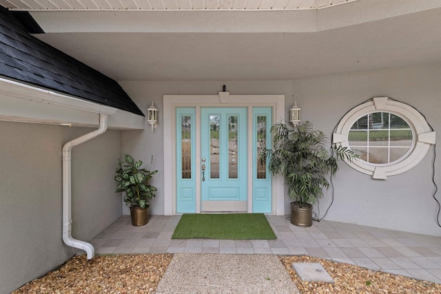  - entrance to property with stucco siding