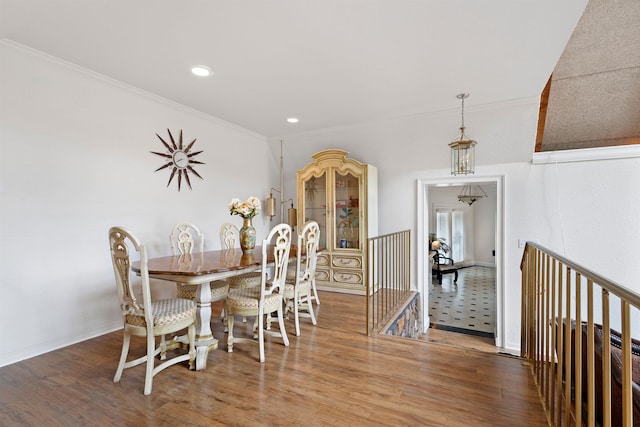  - dining space featuring crown molding, wood finished floors, recessed lighting, and baseboards