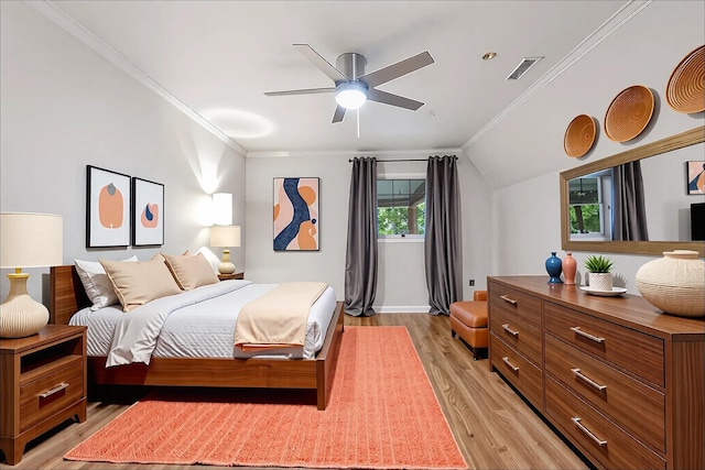  - bedroom featuring light wood-style floors, ornamental molding, baseboards, a ceiling fan, and lofted ceiling