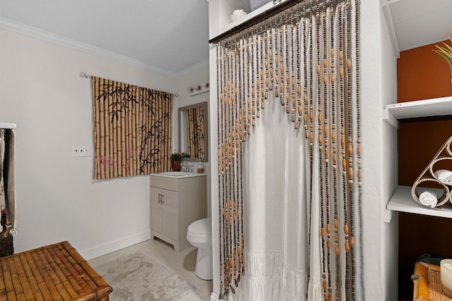  - bathroom featuring vanity, baseboards, toilet, ornamental molding, and tile patterned flooring