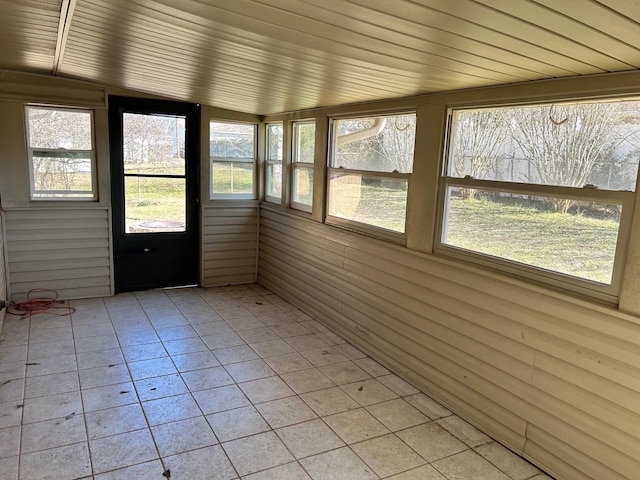 unfurnished sunroom featuring wooden ceiling