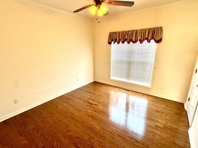 empty room featuring wood-type flooring, ceiling fan, and ornamental molding