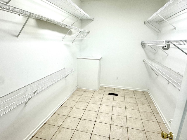 walk in closet featuring light tile patterned floors