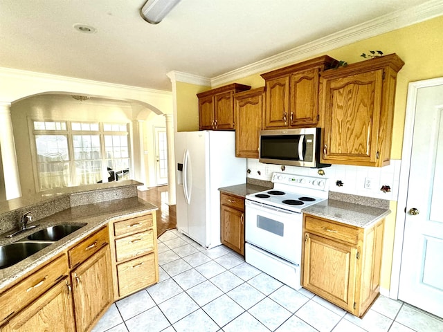 kitchen featuring sink, light tile patterned floors, white appliances, and ornamental molding