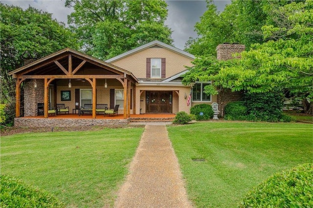 view of front of house featuring a porch and a front yard