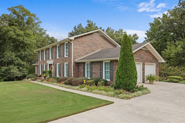 view of front of house with a front lawn and a garage