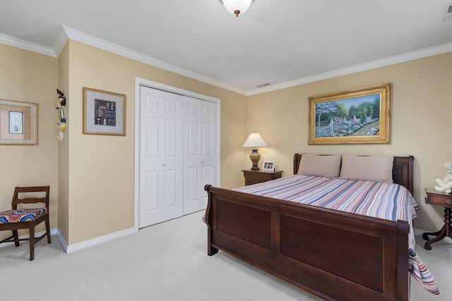 bedroom featuring a closet, light colored carpet, a textured ceiling, and ornamental molding