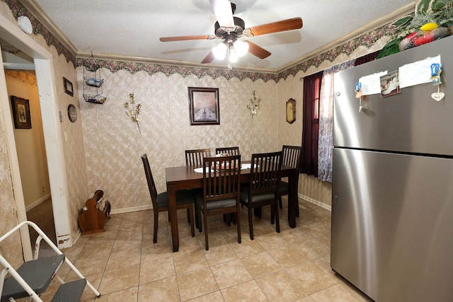 dining area with a textured ceiling, crown molding, ceiling fan, and light tile patterned floors