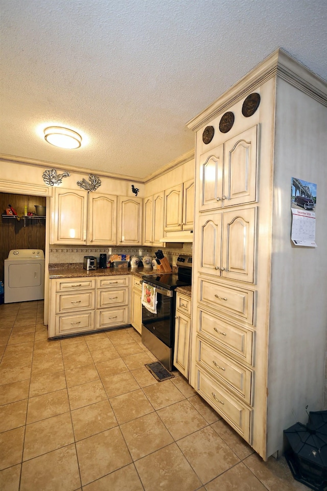 kitchen featuring electric range, light tile patterned flooring, a textured ceiling, and ornamental molding