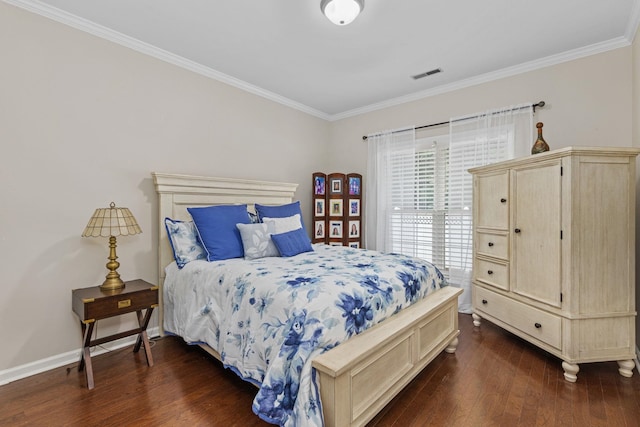  - bedroom featuring dark wood-type flooring, crown molding, and baseboards