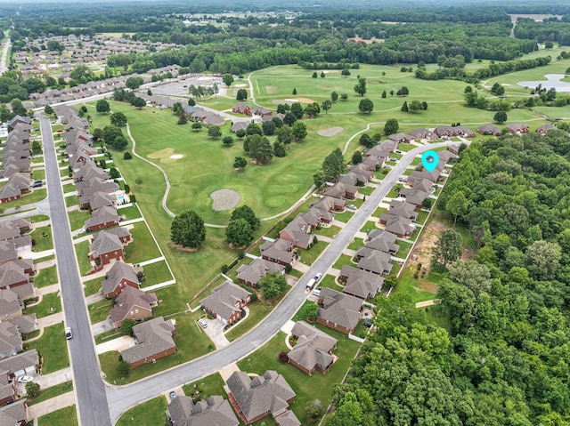  - aerial view of property and surrounding area with nearby suburban area, a golf club, and a tree filled landscape