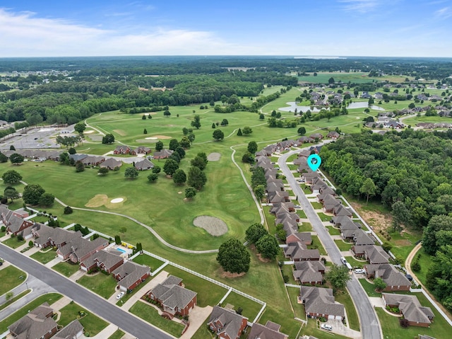  - aerial view of property and surrounding area featuring a golf course and nearby suburban area