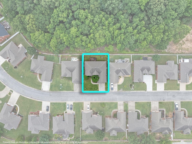  - aerial view of property and surrounding area with nearby suburban area and property boundaries highlighted