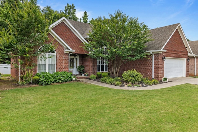 - view of front of home with brick siding, a garage, a front lawn, and driveway